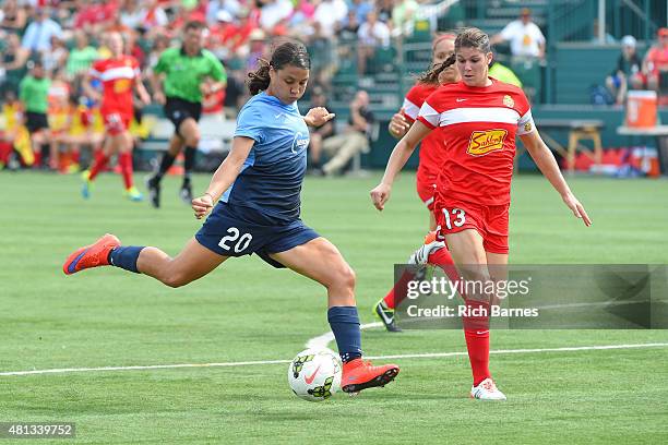 Samantha Kerr of Sky Blue FC takes a shot around Brittany Taylor of Western New York Flash during the first half at Sahlen's Stadium on July 19, 2015...