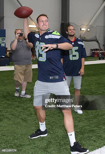 Phil Jones of Manchester United meets Doug Baldwin of the Seattle Seahawks at a Meet and Greet event during the club's pre-season tour of the USA on...