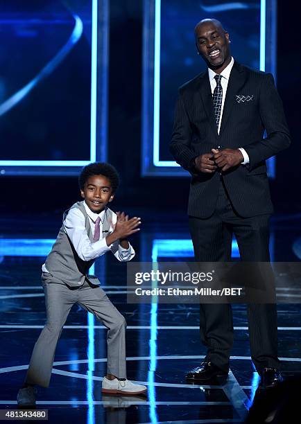 Actor Miles Brown and former NBA player Gary Payton present an award during The Players' Awards presented by BET at the Rio Hotel & Casino on July...