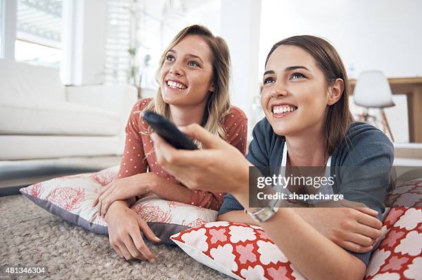 enjoying their favorite tv show - dvd stock pictures, royalty-free photos & images
