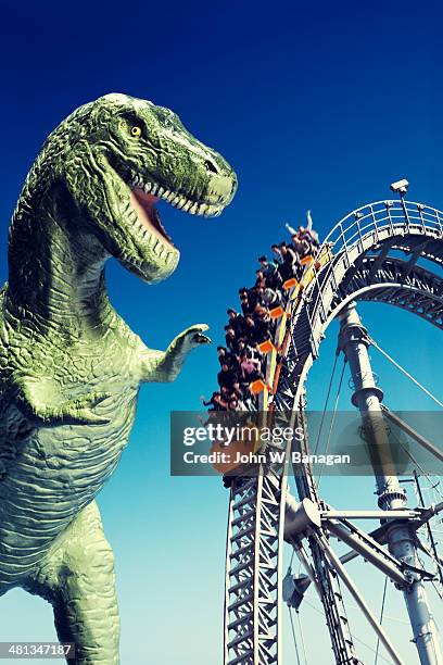 t rex and roller coaster - time of day stock pictures, royalty-free photos & images