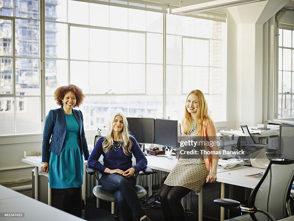 Group of smiling businesswomen in office