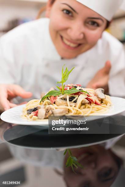 Chef Discrep Chef Presenting Completed Dish Photos and Premium High Res Pictures ...