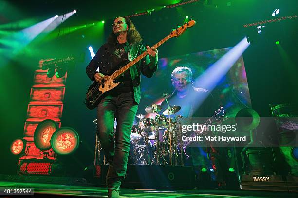 Geddy Lee and Neil Peart of Rush performs on stage during the R40 LIVE Tour at KeyArena on July 19, 2015 in Seattle, Washington.