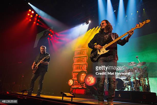 Alex Lifeson, Geddy Lee and Neil Peart of Rush performs on stage during the R40 LIVE Tour at KeyArena on July 19, 2015 in Seattle, Washington.