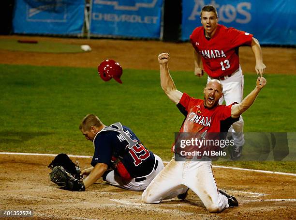 Peter Orr of Canada celebrates scoring the winning run in the tenth inning as Thomas Murphy of the USA and Tyler O'Neill of Canada looks after their...