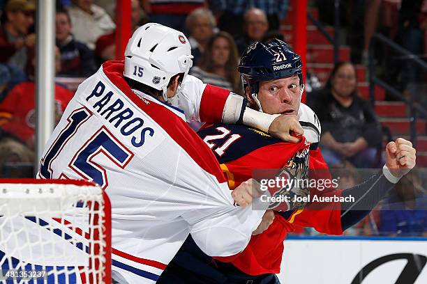 George Parros of the Montreal Canadiens and Krys Barch of the Florida Panthers fight during first period action at the BB&T Center on March 29, 2014...