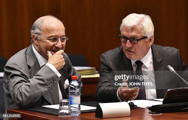 French Foreign Affairs minister Laurent Fabius talks with German Foreign Minister Frank-Walter Steinmeier during a Foreign Affairs meeting at the...