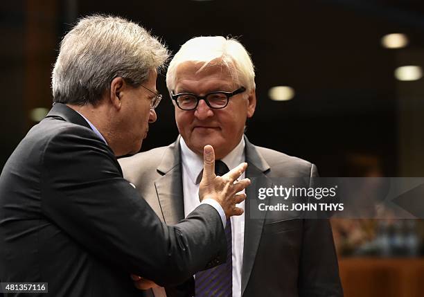 Italian Foreign Affairs Minister Paolo Gentiloni talks with German Foreign Minister Frank-Walter Steinmeier during a Foreign Affairs meeting at the...