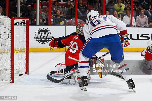 Max Pacioretty of the Montreal Canadiens scores a second period goal past goaltender Dan Ellis of the Florida Panthers at the BB&T Center on March...