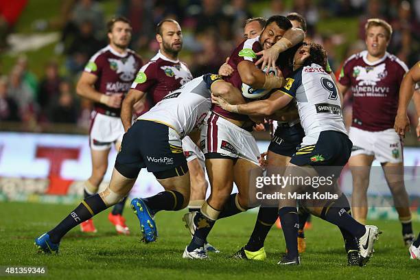 Ligi Sao of the Eagles is tackled during the round 19 NRL match between the Manly Sea Eagles and the North Queensland Cowboys at Brookvale Oval on...