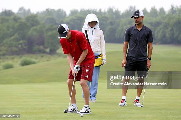 Sebastian Rode of FC Bayern Muenchen putts at the Audi quattro Cup 2015 at Sheshan Golf Club during day 4 of the FC Bayern Audi China Summer...