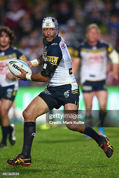 Johnathan Thurston of the Cowboys looks to pass during the round 19 NRL match between the Manly Sea Eagles and the North Queensland Cowboys at...