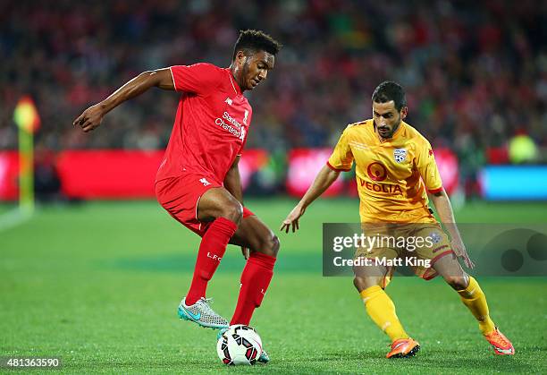 Joe Gomez of Liverpool is challenged by Sergio Cirio of United during the international friendly match between Adelaide United and Liverpool FC at...