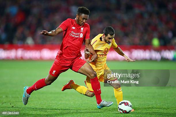 Sergio Cirio of United is challenged by Joe Gomez of Liverpool during the international friendly match between Adelaide United and Liverpool FC at...