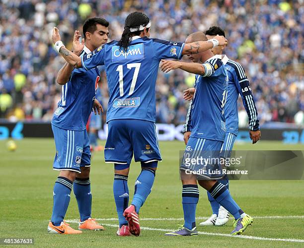 Players of Millonarios celebrate a scored goal during a match between Millonarios and Patriotas FC as part of the Liga Postobon I 2014 at Nemesio...