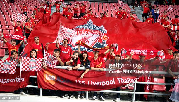 Liverpool fans celebrate after the international friendly match between Thai Premier League All Stars and Liverpool FC at Rajamangala Stadium in...