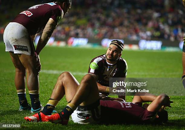 Steve Matai, Justin Horo and Peta Hiku of the Eagles look dejected after a Cowboys try during the round 19 NRL match between the Manly Sea Eagles and...