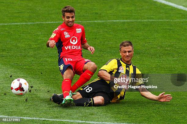 Ben Sigmund of the Phoenix tackles Michael Zullo of Adelaide United during the round 25 A-League match between Wellington Phoenix and Adelaide United...