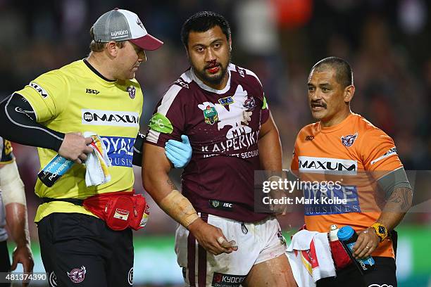 Ligi Sao of the Eagles receives attention from the trainers during the round 19 NRL match between the Manly Sea Eagles and the North Queensland...