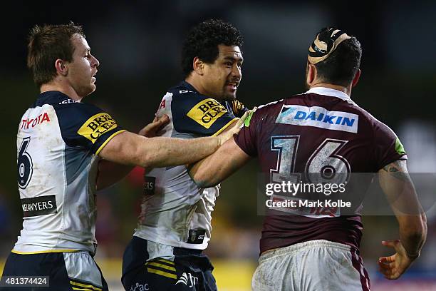 Michael Morgan and Matthew Wright of the Cowboys exchange words with Justin Horo of the Eagles during the round 19 NRL match between the Manly Sea...