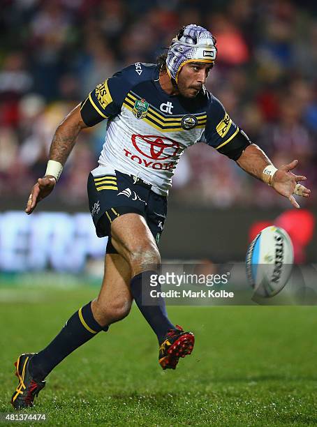 Johnathan Thurston of the Cowboys kicks ahead during the round 19 NRL match between the Manly Sea Eagles and the North Queensland Cowboys at...
