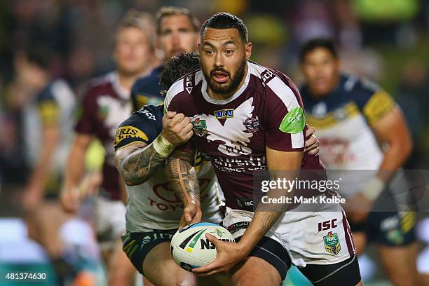 Feleti Mateo of the Eagles runs the ball during the round 19 NRL match between the Manly Sea Eagles and the North Queensland Cowboys at Brookvale...