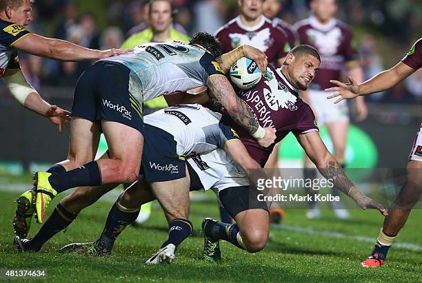 Willie Mason of the Eagles is tackled during the round 19 NRL match between the Manly Sea Eagles and the North Queensland Cowboys at Brookvale Oval...