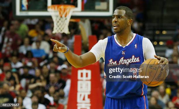 Chris Paul of the Los Angeles Clippers brings the ball upcourt against the Houston Rockets during the game at the Toyota Center on March 29, 2014 in...