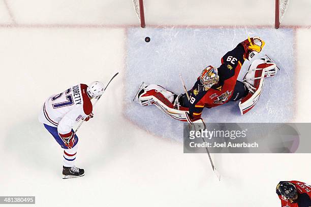 Max Pacioretty of the Montreal Canadiens scores a goal against goaltender Dan Ellis of the Florida Panthers in the second period at the BB&T Center...