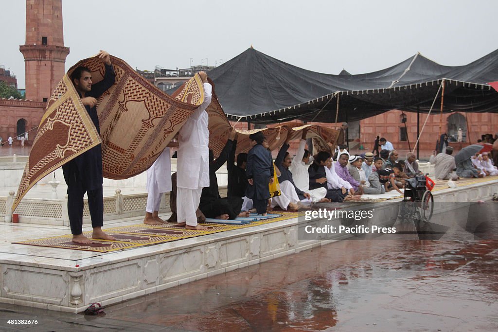 Pakistani faithful Muslim devotees take part in Eid prayers...
