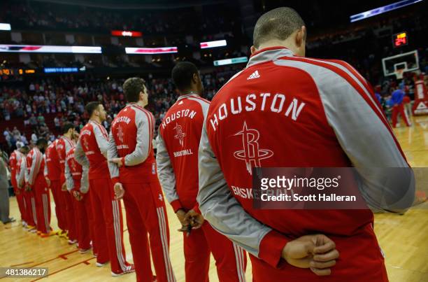 Members of the Houston Rockets stand during the National Anthem before the game against the Los Angeles Clippers at the Toyota Center on March 29,...