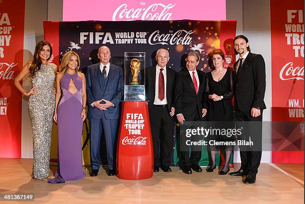 Jana Ina Zarella, Sylvie Meis, Horst Eckel, Bernd Hoelzenbein, Pierre Littbarski, Monica Lierhaus and Neven Subotic pose with the trophy during a...