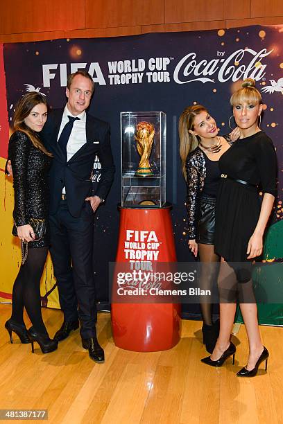 Angelina Huth, Alexander Posth, Dahab Gammour and Senna Gammour pose with the trophy at the Gala Night of the FIFA World Cup Trophy Tour on March 29,...