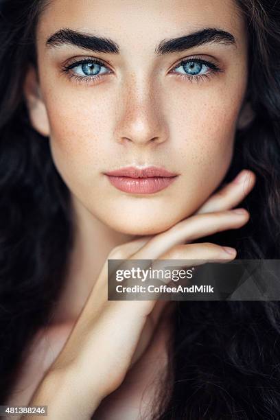 outdoor shot of young beautiful woman - woman blue eyes stock pictures, royalty-free photos & images