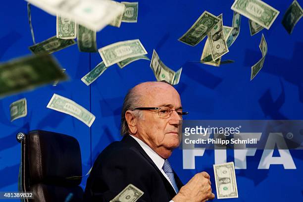 Comedian Simon Brodkin throws dollar bills at FIFA President Joseph S. Blatter during a press conference at the Extraordinary FIFA Executive...