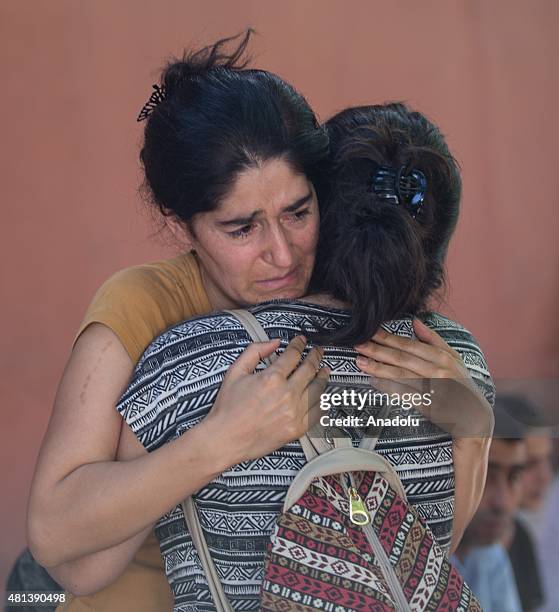 Relatives of victims cry at the site of an explosion targeting a cultural center in Suruc district of Sanliurfa, Turkey on July 20, 2015. At least 27...