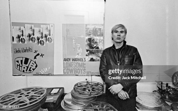 Andy Warhol at the Factory with posters for Tub Girls and Lonesome Cowboys .