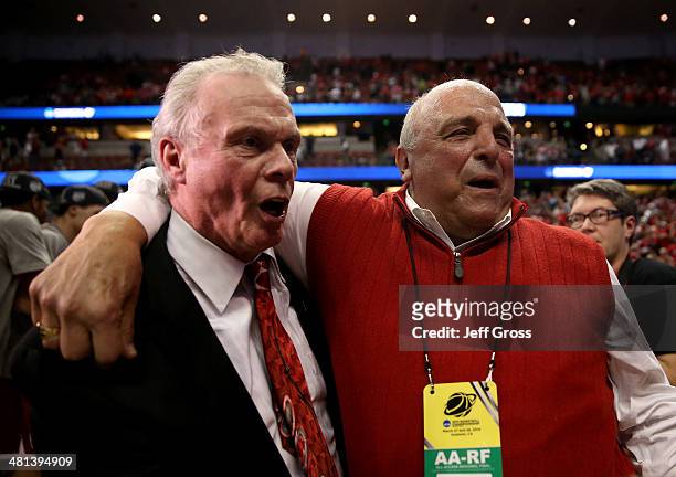 Head coach Bo Ryan of the Wisconsin Badgers celebrates with Director of Athletics Barry Alvarez after defeating the Arizona Wildcats 64-63 in...