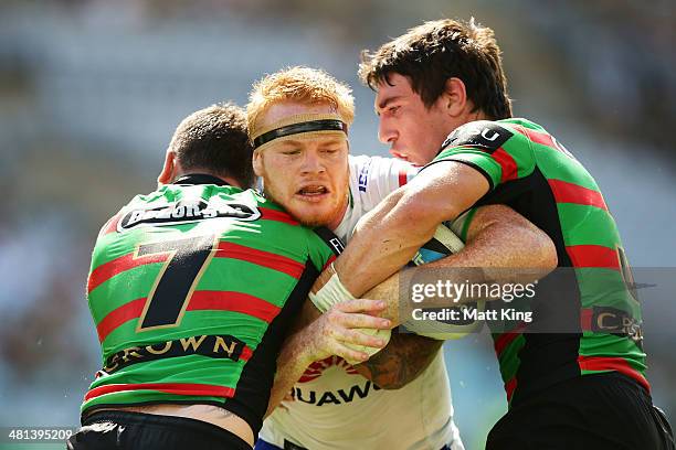 Joel Edwards of the Raiders is tackled during the round four NRL match between the South Sydney Rabbitohs and the Canberra Raiders at ANZ Stadium on...