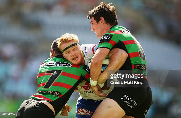 Joel Edwards of the Raiders is tackled during the round four NRL match between the South Sydney Rabbitohs and the Canberra Raiders at ANZ Stadium on...