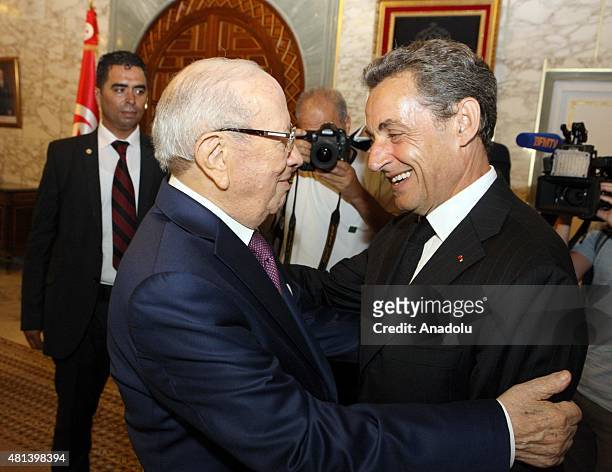 Tunisian President Beji Caid Essebsi greets former French president Nicolas Sarkozy on July 20, 2015 at the Carthage presidential Palace on the...