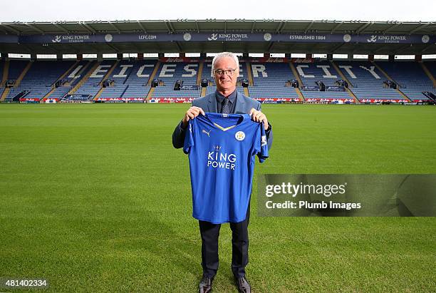Manager Claudio Ranieri of Leicester City poses on the pitch with their football shirt during a Leicester City training session and press conference...