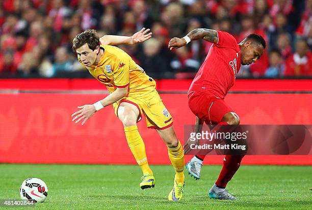 Craig Goodwin of United is challenged by Nathaniel Clyne of Liverpool during the international friendly match between Adelaide United and Liverpool...