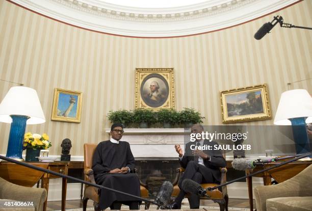 President Barack Obama meets with Nigerian President Muhammadu Buhari in the Oval Office of the White House in Washington, DC, July 20, 2015. Obama...