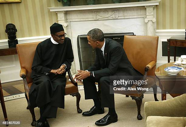 President Barack Obama meets with Nigerian President Muhammadu Buhari in the Oval Office of the White House July 20, 2015 in Washington, DC. The two...