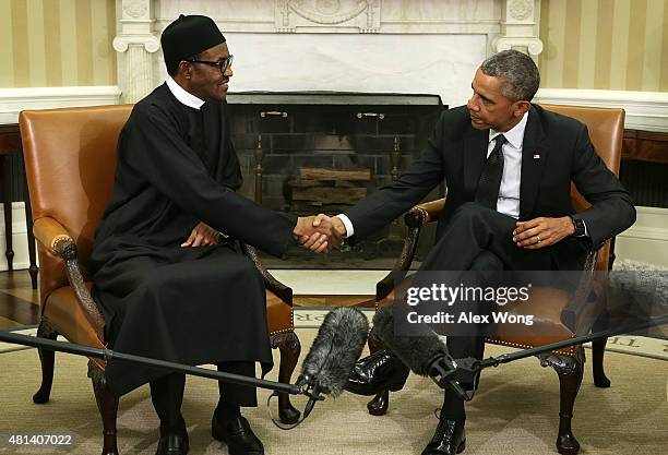 President Barack Obama shakes hands with Nigerian President Muhammadu Buhari during a meeting in the Oval Office of the White House July 20, 2015 in...