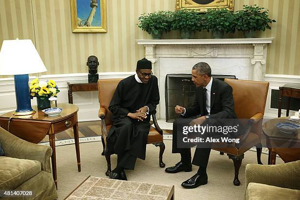 President Barack Obama meets with Nigerian President Muhammadu Buhari in the Oval Office of the White House July 20, 2015 in Washington, DC. The two...