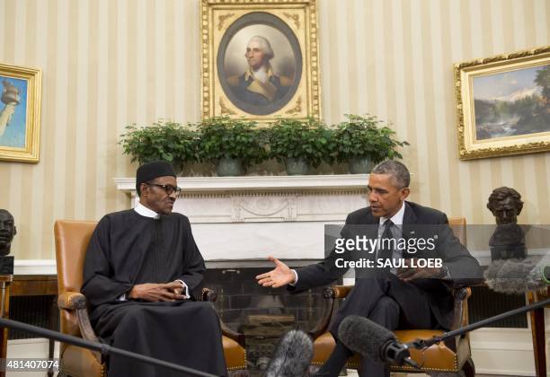 President Barack Obama meets with Nigerian President Muhammadu Buhari in the Oval Office of the White House in Washington, DC, July 20, 2015. Obama...