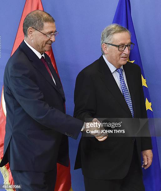 European Union Commission President Jean-Claude Juncker welcomes Prime Minister of Tunisia Habib Essid before their bilateral meeting at the EU...